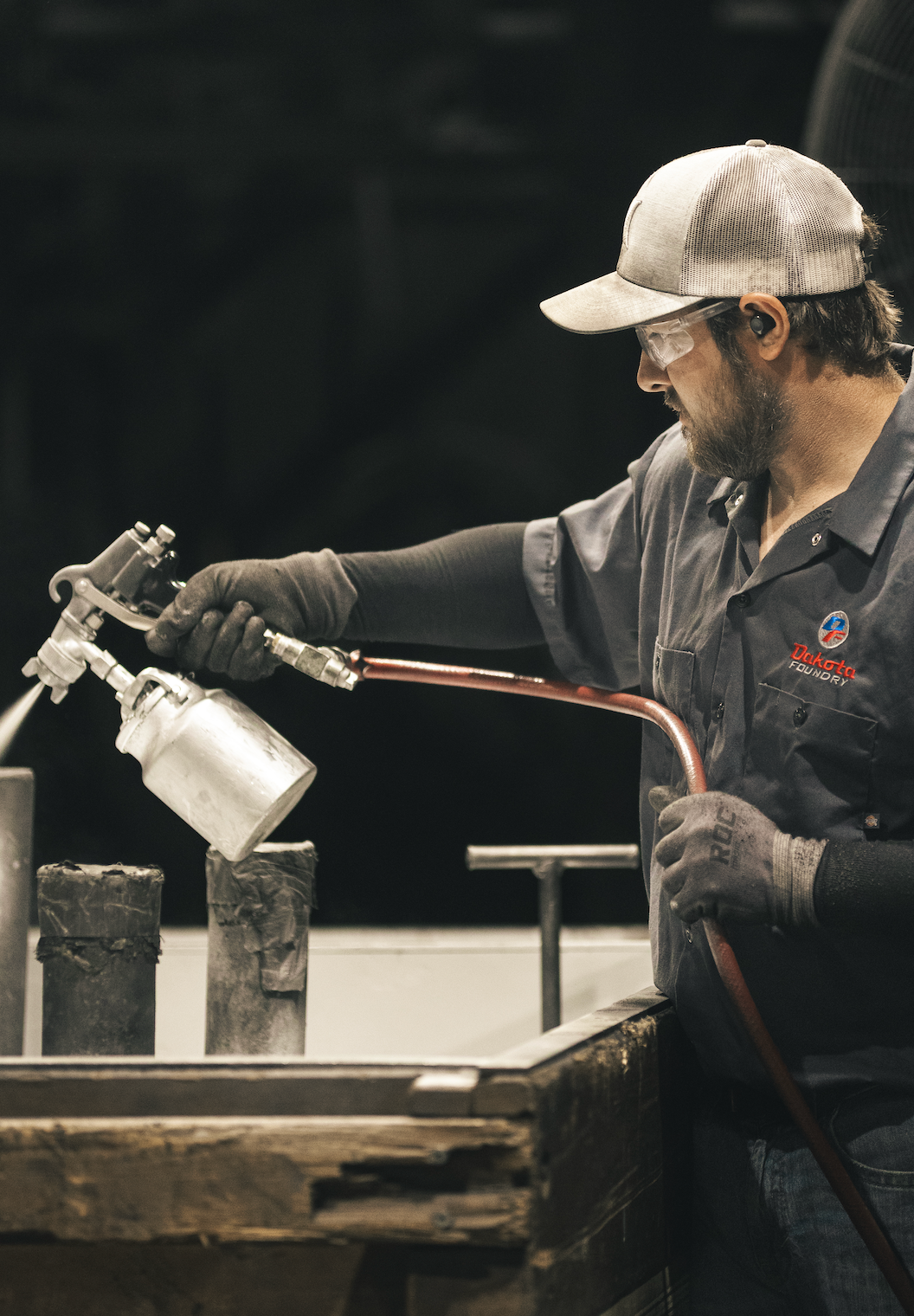 A welder working in a garage workshop — where Kory Anderson started