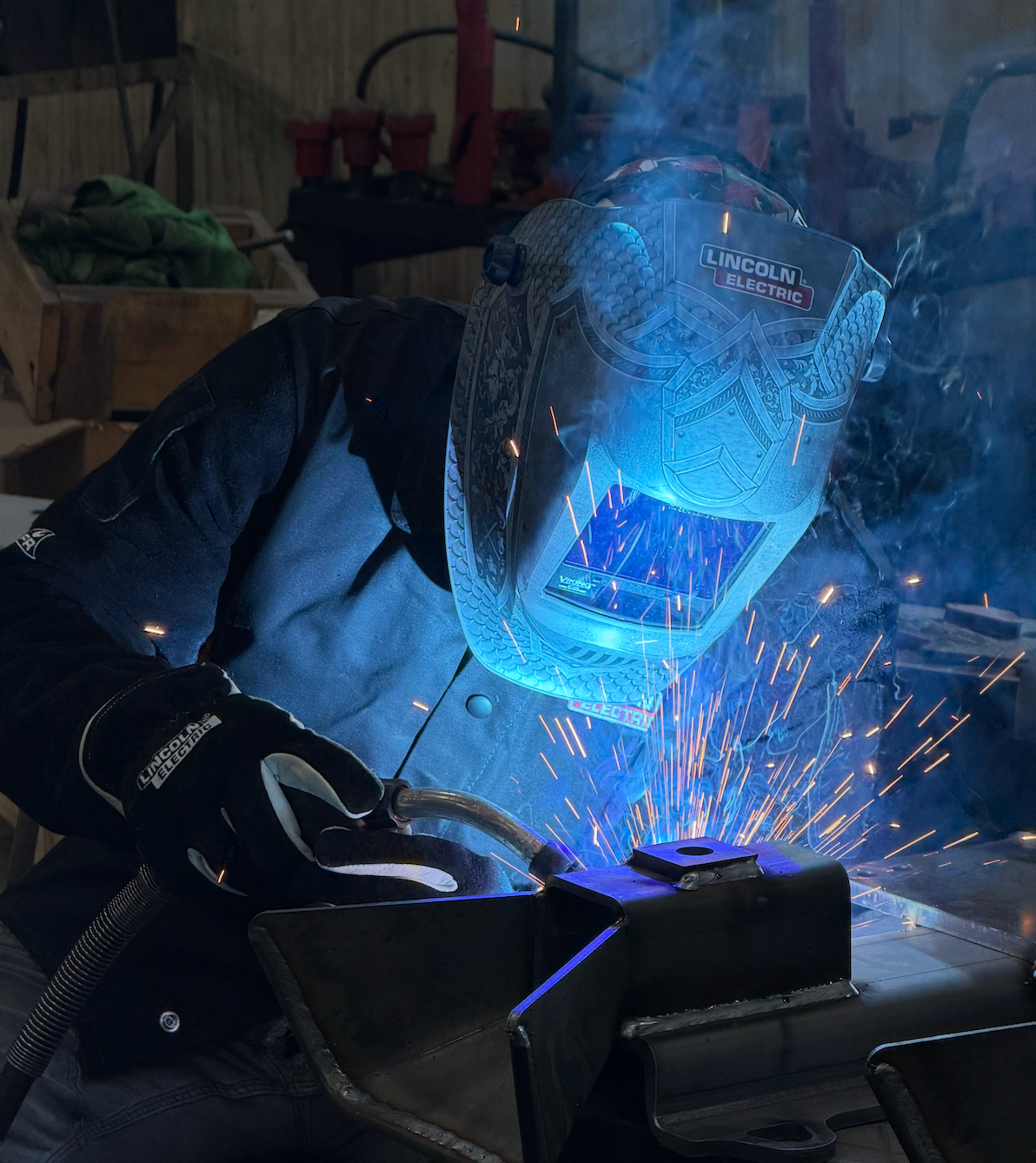 Kory Anderson actively welding with Lincoln Electric equipment in his shop