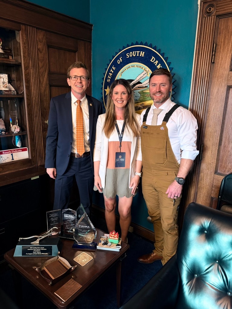 Kory and Ali Anderson with a representative in a South Dakota congressional office
